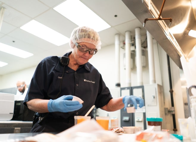 Corporate Citizenship Image - Food Processing Technician Working in Lab